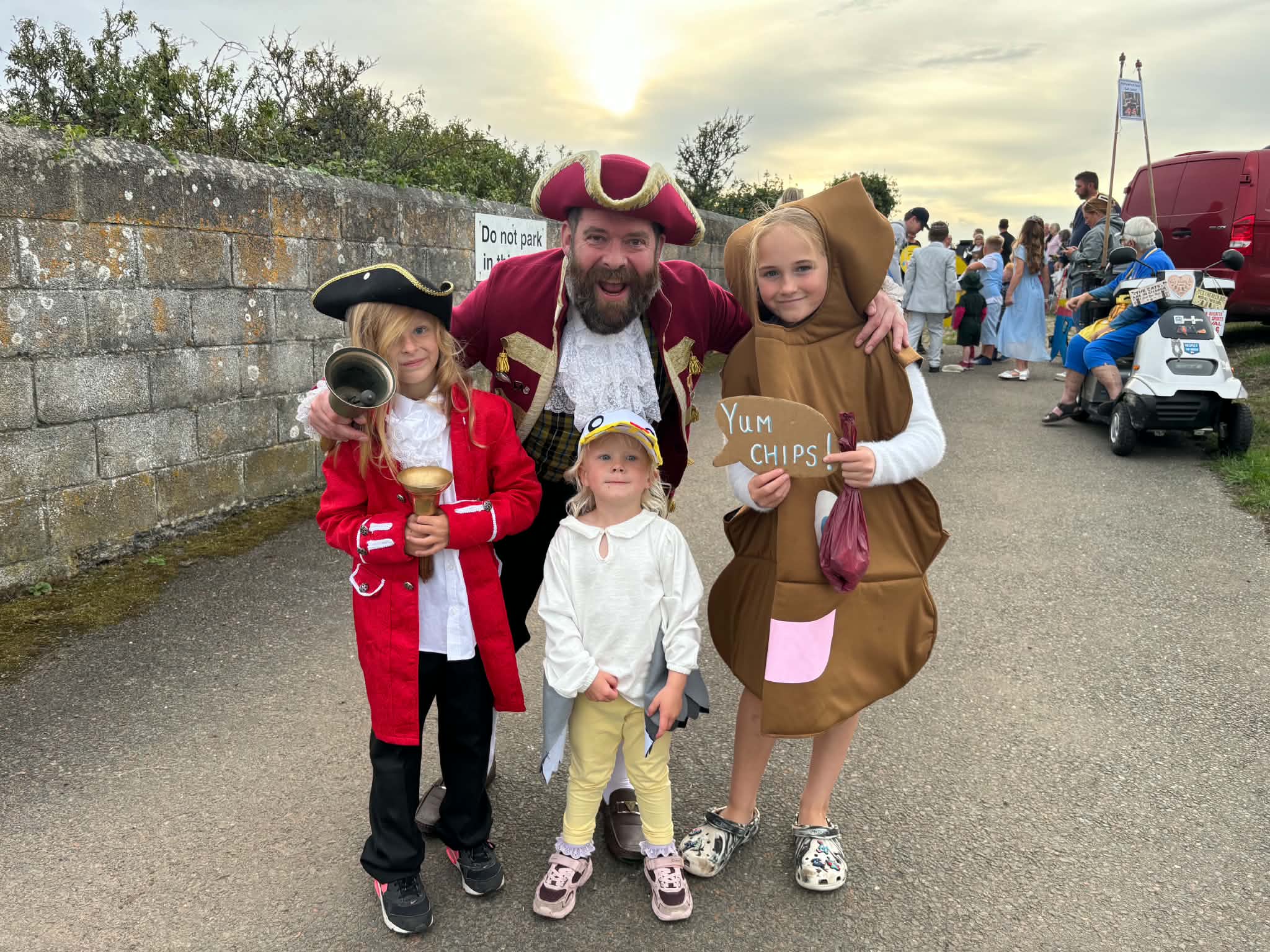 Pirate and children in colourful carnival costumes at Polruan Regatta